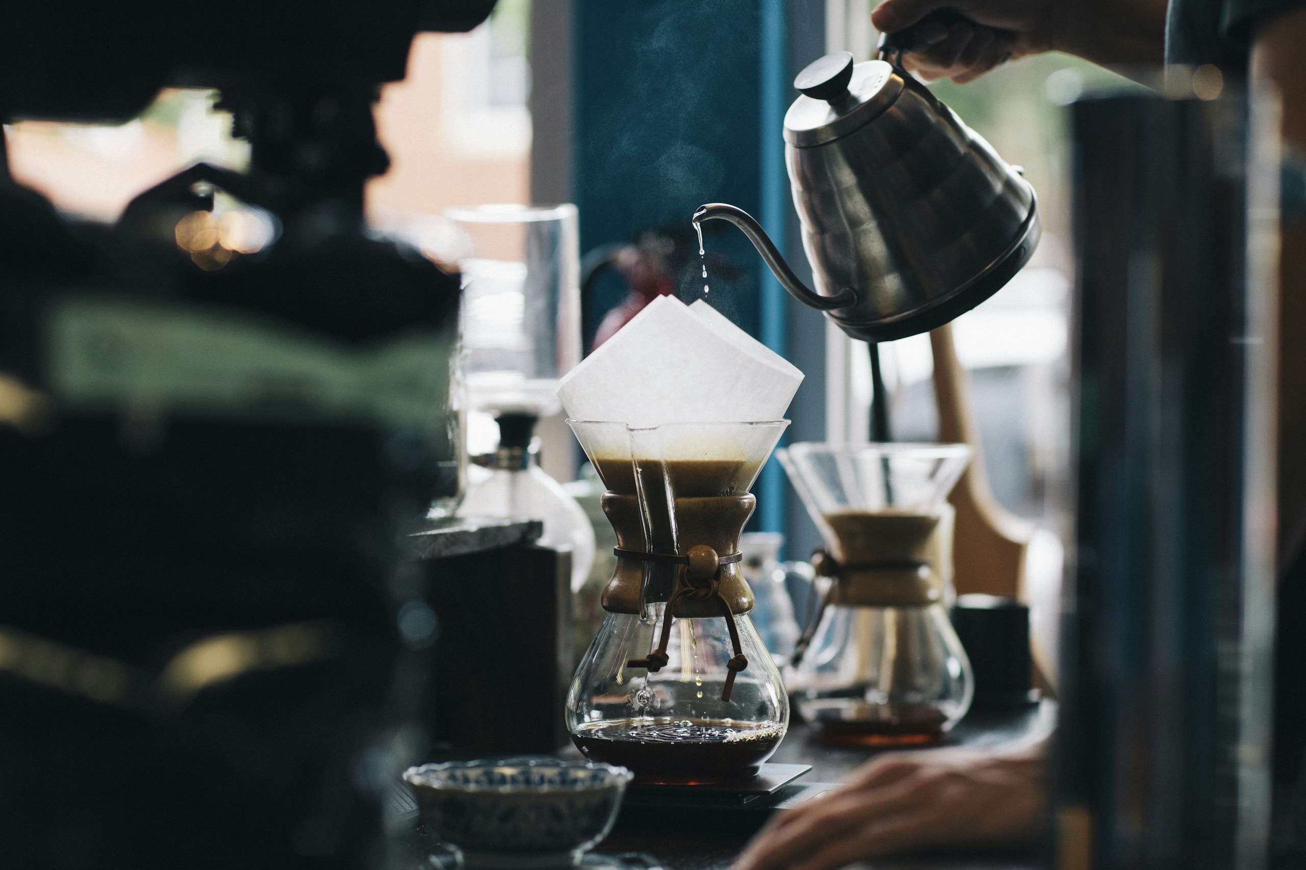 Pour-over coffee being brewed in a glass carafe